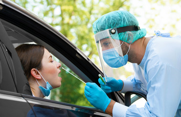 Woman getting tested at a coronavirus drive thru station