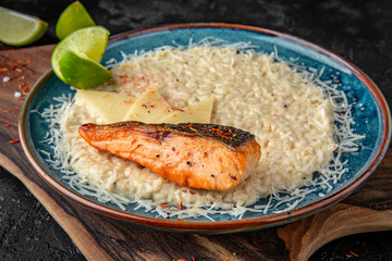 Risotto in champagne cooked with tender salmon fillet