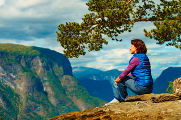 Fototapeta na wymiar Tourist on mountains top, Norway