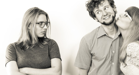 Jealous woman with happy couple