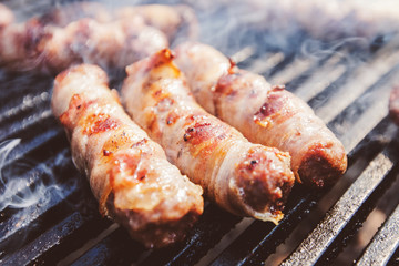 Delicious rolled meat with bacon on BBQ party