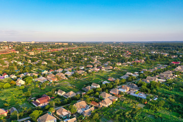 Flying over the evening beautiful modern city