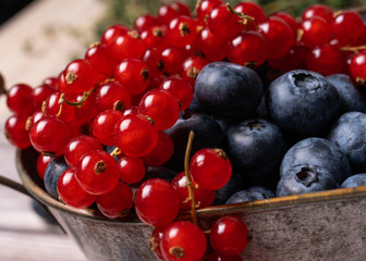 blueberries and red currants in a bowl