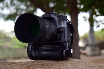 
A camera in the hand of a woman
