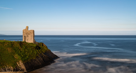 Fototapeta na wymiar Ballybunion medieval castle ruins on the cliffs of the west coast of Ireland