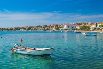 Fototapeta na wymiar Town of Novalja on the island of Pag, Adriatic sea in Croatia. Boats in marina. Tourist destination.