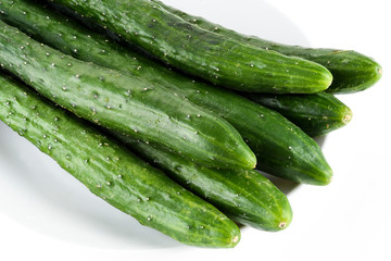 Close-up of fresh Gherkin on a white dish