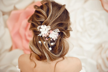 Closeup of Bridal wedding hairstyle with jewelry wreath. Back view. Elegant bride with Wavy hair.