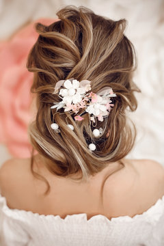 Closeup of Bridal wedding hairstyle with jewelry wreath. Back view. Elegant bride with Wavy hair.