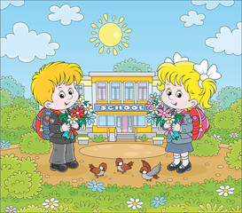 Happy schoolchildren with colorful bouquets of flowers and schoolbags standing in front of their school on a sunny day on the first of September, vector cartoon illustration