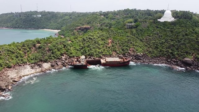 The rusty shipwreck run aground. Sri Lanka