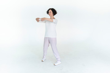 woman practicing qi qong at white studio traditional chinese gymnastics	