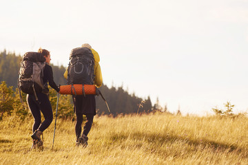 Cute young couple. Majestic Carpathian Mountains. Beautiful landscape of untouched nature