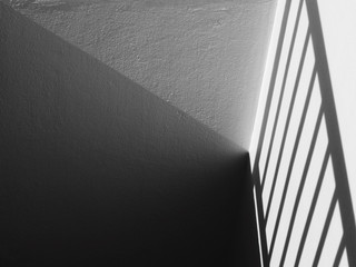 shadow of railing stair on white wall background