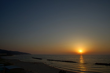 Amazing colored sunset form the beach in Japan