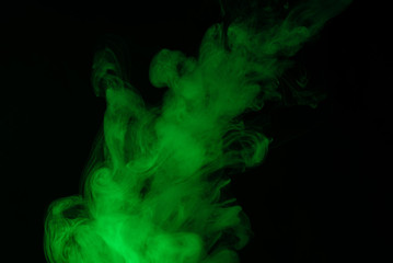 Green steam on a black background.