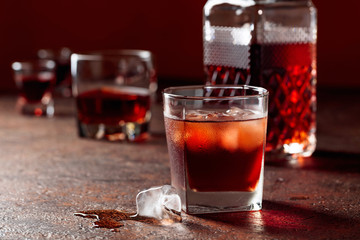 Whiskey in frosted glass with ice.