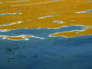 abstract colorful water reflection in canal