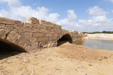 Remains  of a bridge across Nahal Taninim River - Crocodile River near ruins of Turris Slinarum - Salt Tower fortress near to Jisr Ez Zarqa arab village. Located near the Atlit city in northern Israel