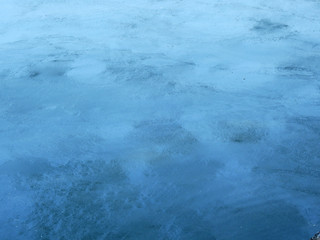 dirty blue water with stain of oil in the pond