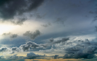 Sunset sky and gray and golden clouds. Gray sky and fluffy clouds. Thunder and storm sky. Sad and...