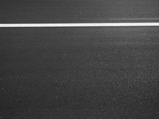 Fototapeta premium dark asphalt road with white line of lane
