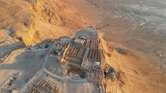 Aerial view of ruins of Massada is a fortress built by Herod Great on a cliff-top off the coast of Dead Sea. Destroyed by the Romans in the 1st century AD e. Included in the UNESCO World Heritage List