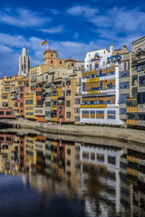 Fototapeta na wymiar Colorful houses of Girona on the Onyar River bank. Gerona, Catalonia, Spain.