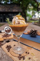 Coffee and ice cream on a brown wooden table
