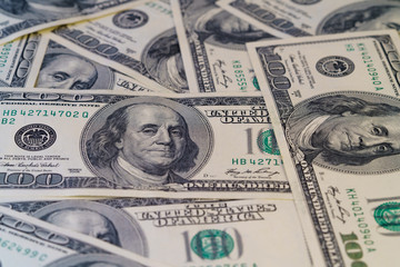 Fragment of 100 dollar bill. Close up of American currency. US dollar background. High resolution