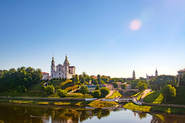 Naklejka premium Vitebsk,Belarus - 18 July 2020 : Holy Assumption Cathedral of the Assumption on the hill and the Holy Spirit convent and Western Dvina River. Vitebsk, Belarus