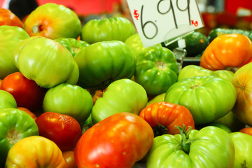 Pile of delicious looking tomatoes on display at a local market