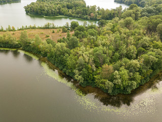 Aerial view. Green bank of the Dnieper river on a summer day.