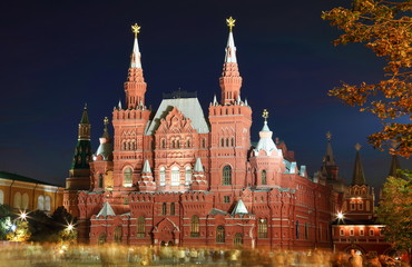 Fototapeta premium Huge red castle like building enlightened at night. State Historical Museum at Red Square, Moscow, Russia