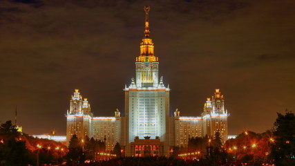 Fototapeta premium Front view of monumental enlightened Lomonosov university in Moscow, Russia at night