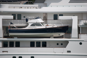 
motorboat tender on the side of a yacht