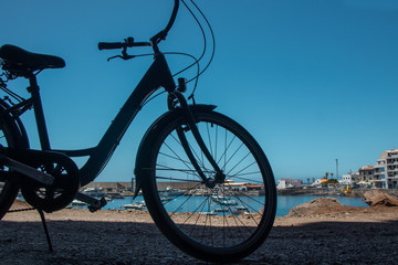 Silhouette of a part of a bicycle with a sea view in Valle Gran Ray, La Gomera, Canary islands, Spain