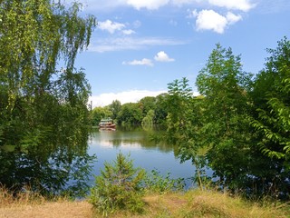 Summer landscape, boat on the lake