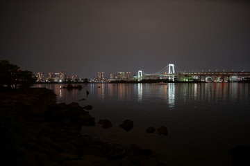 Tokyo, Japan at Rainbow Bridge and Tokyo Bay.