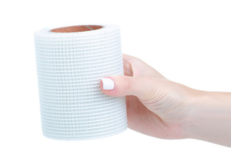 Drywall tape roll in hand on white background isolation