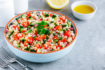 Couscous Tabbouleh Salad with fresh tomatoes, cucumbers and red onions