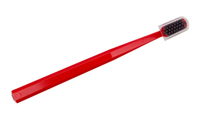 Red toothbrush with a plastic transparent lid isolated on a white background