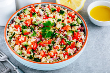 Couscous Tabbouleh Salad with fresh tomatoes, cucumbers and red onions