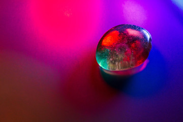Mineral gem colorfully illuminated showing abstract details.