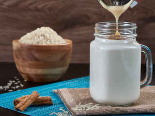 placing condensed milk in chicha de arroz width cinnamon typical Venezuelan drink also made with corn