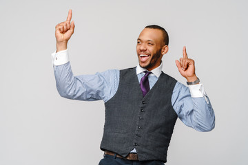 Young smart shouting african-american businessman doing success win gesture