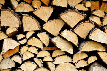 Natural wooden background,closeup of chopped firewood, Stack of dry chopped wooden logs