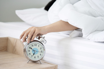 A Man Hand Try to Stop the Alarm of the Clock in the Morning