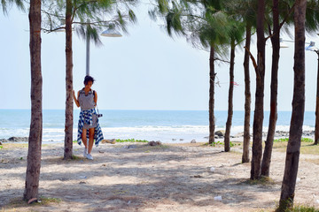 Girl on the beach with trees