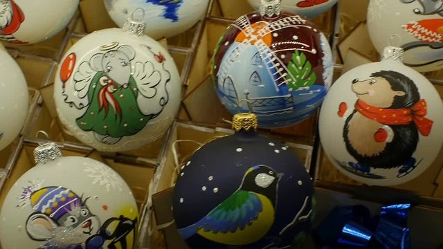 box of old vintage christmas balls close to, camera in motion